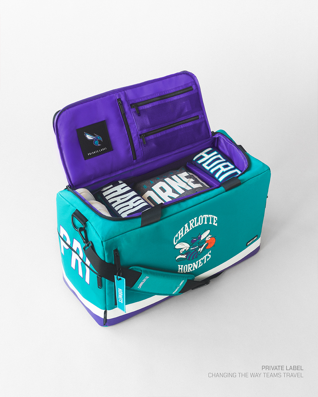 Teal duffle with a purple interior for the Hornets