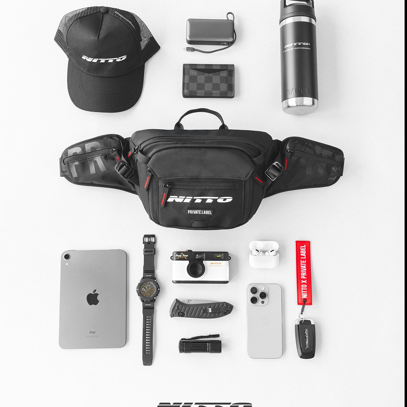 Black nitto sling bag surrounded by accessories