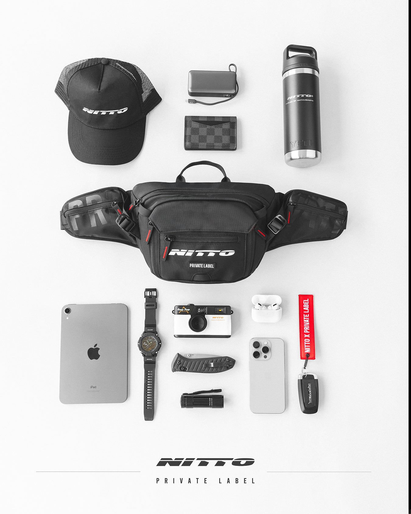 Black nitto sling bag surrounded by accessories