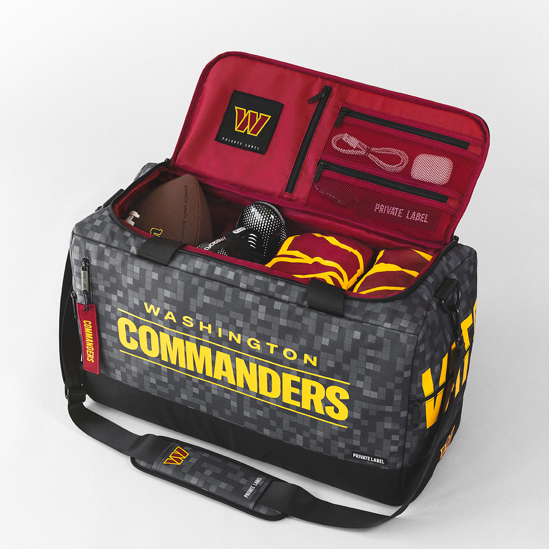 Commanders themed duffle bag with football gear packed inside