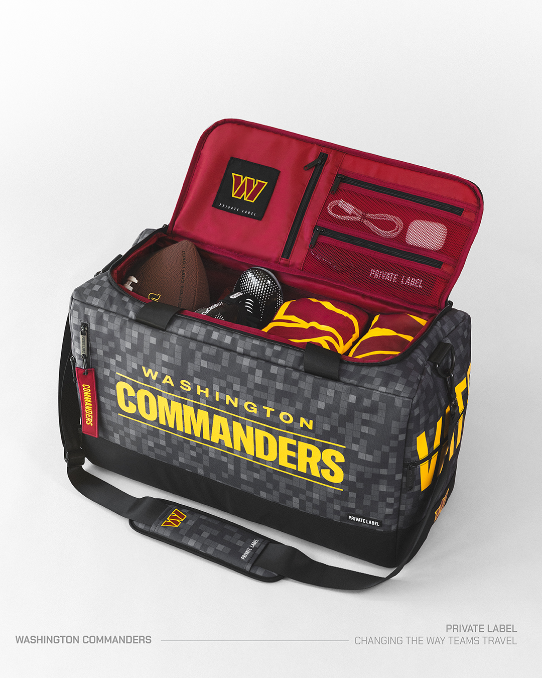 Commanders themed duffle bag with football gear packed inside