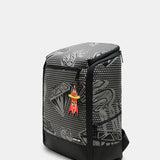 A black and gray patterned backpack with a small red and yellow cartoon character charm hanging from the zipper, shown on a light gray background.