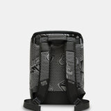 A black and gray patterned backpack shown from the back, featuring a textured honeycomb design with stylized graphic logos and black shoulder straps, set against a light gray background.