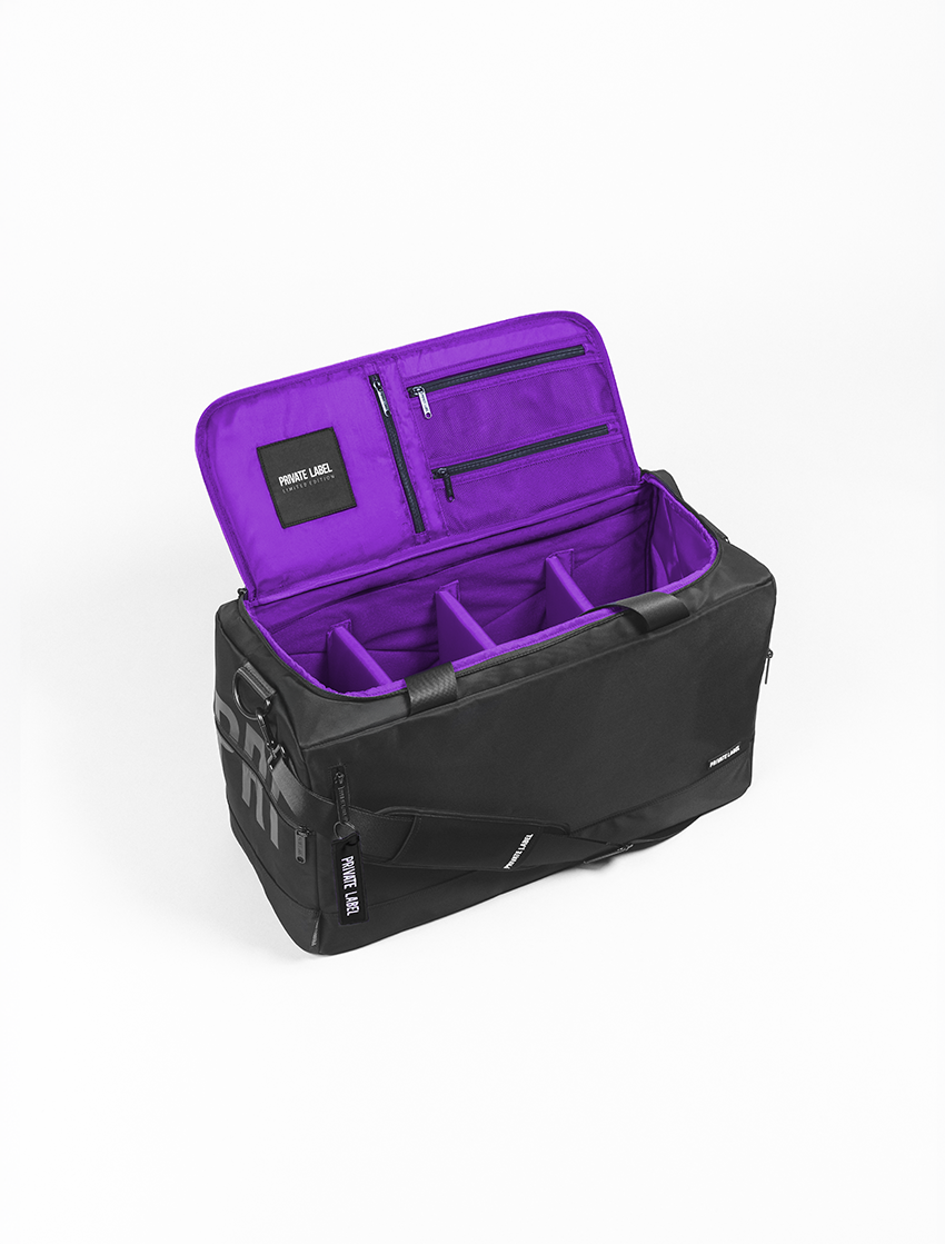 A black and purple travel organizer bag shown open, featuring a purple interior with multiple zippered pockets and organizer compartments, photographed on a clean white background.