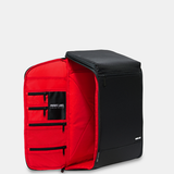 Black backpack with red interior opened from the side panel