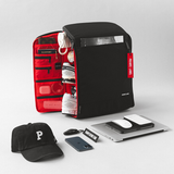 Backpack with side panel open to display how items can be organized