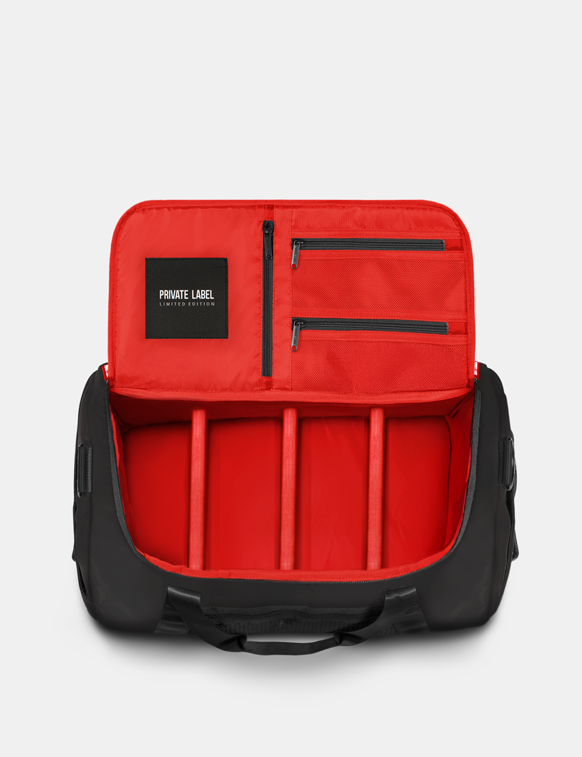 black duffle with a red interior on a light gray background