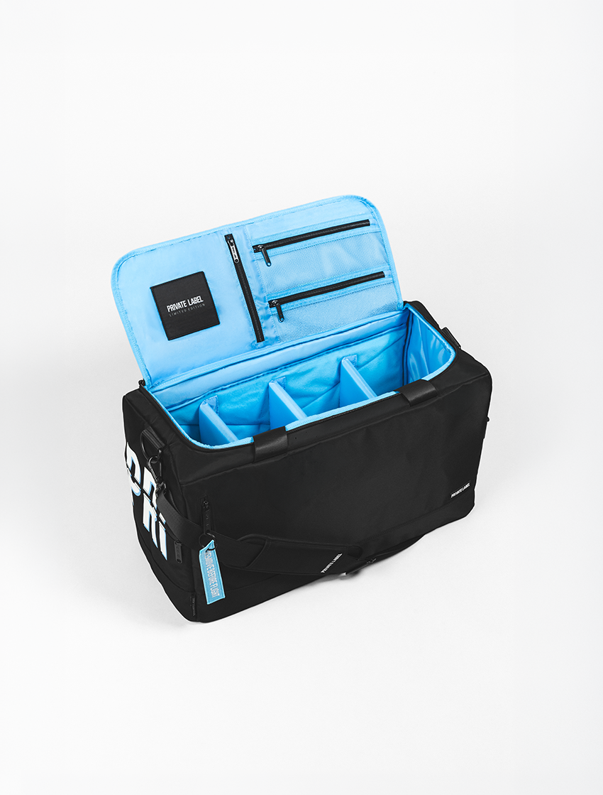 Black duffle with light blue interior on a light grey background