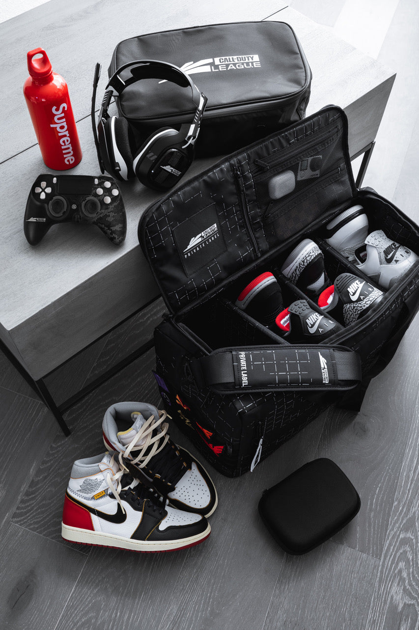 Call of duty league branded bag with Private Label. Shoes packed inside and gaming accessories surrounding it