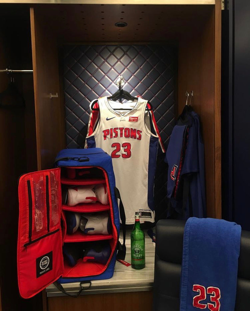 Blue and red duffle bag designed for the pistons inside their locker room