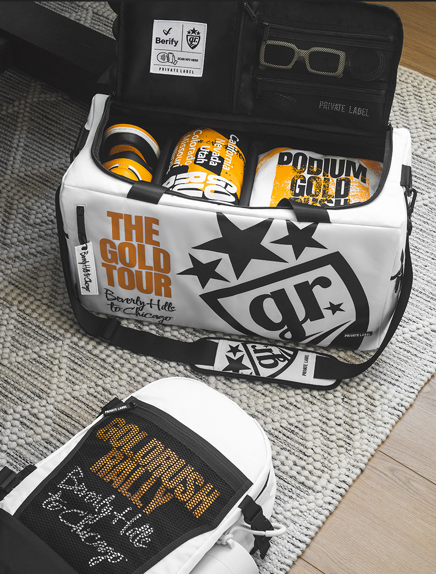Gold Rush Rally branded white bag with GRR merchandise packed inside with a white GRR matching backpack
