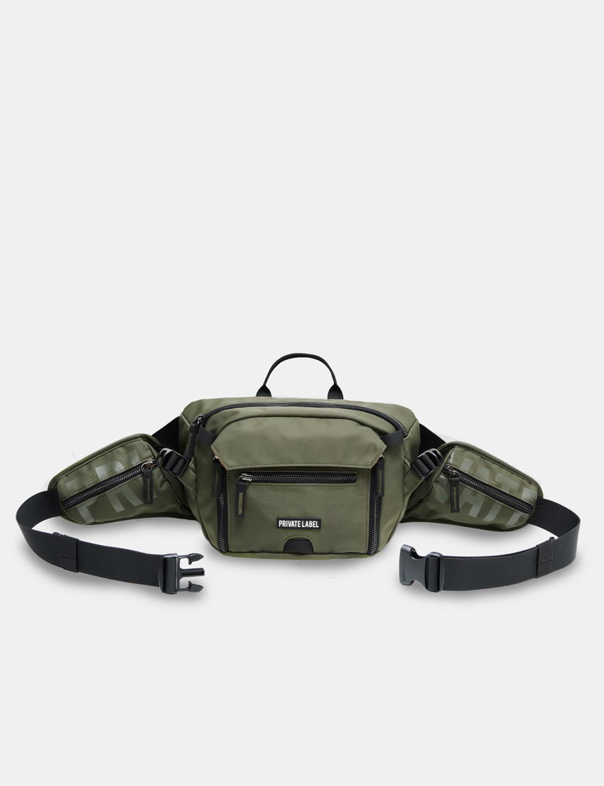 green sling bag on a light gray background