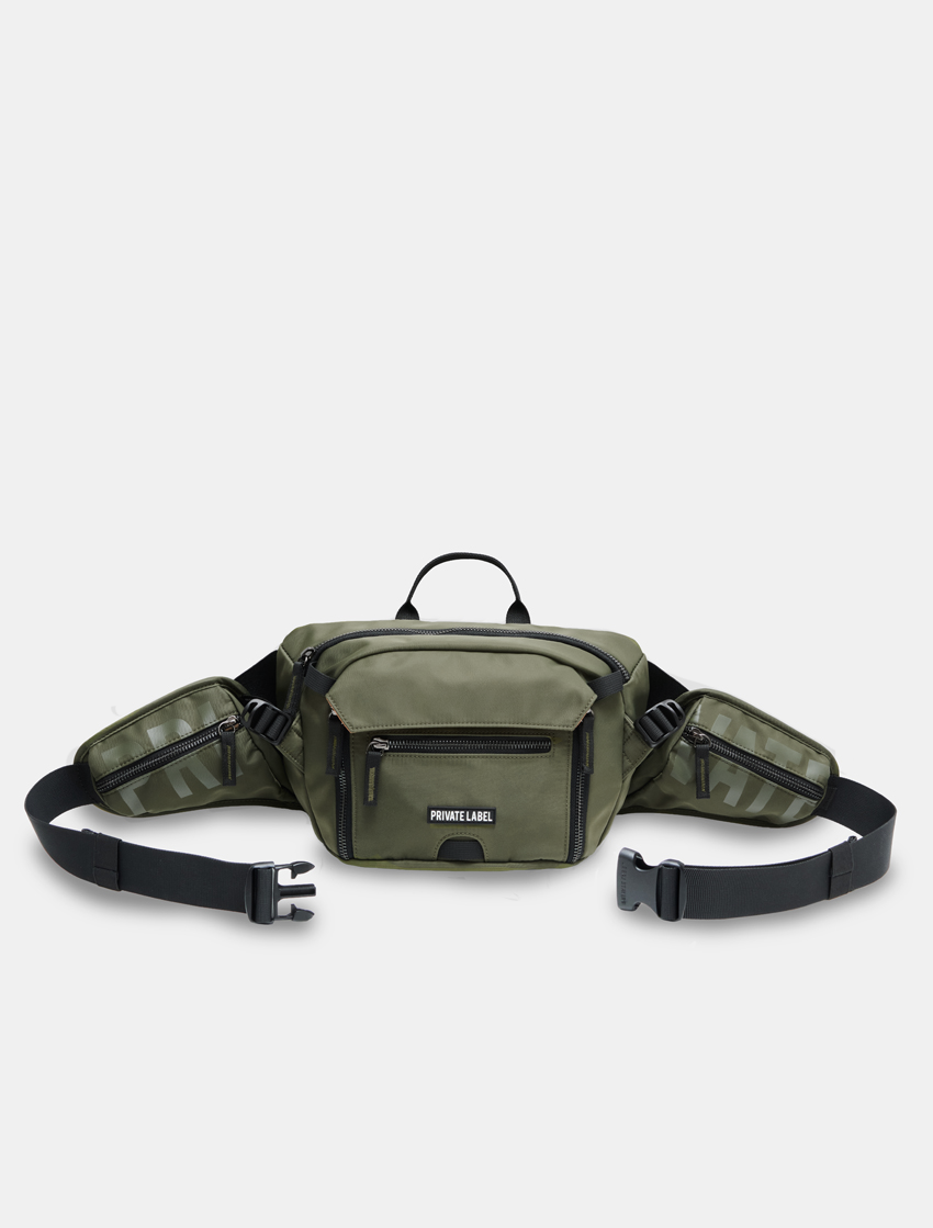 green sling bag on a light gray background