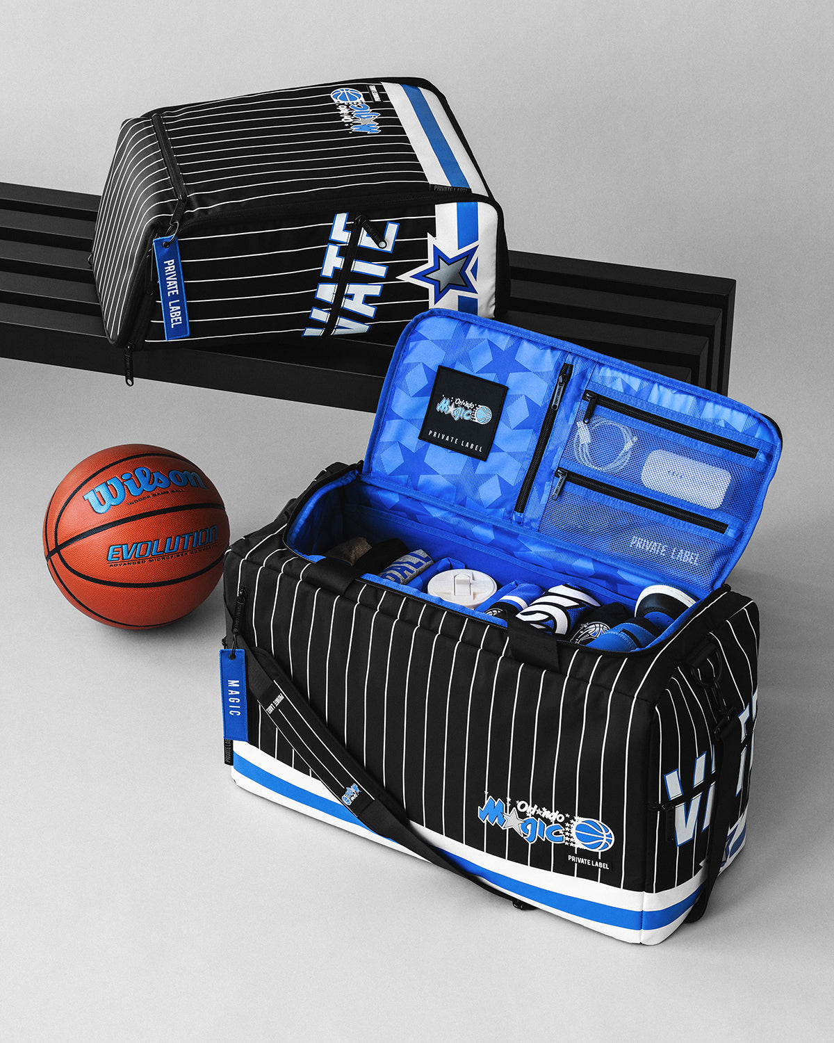 Orlando Magic matching backpack & duffle with basketball gear packed inside. 