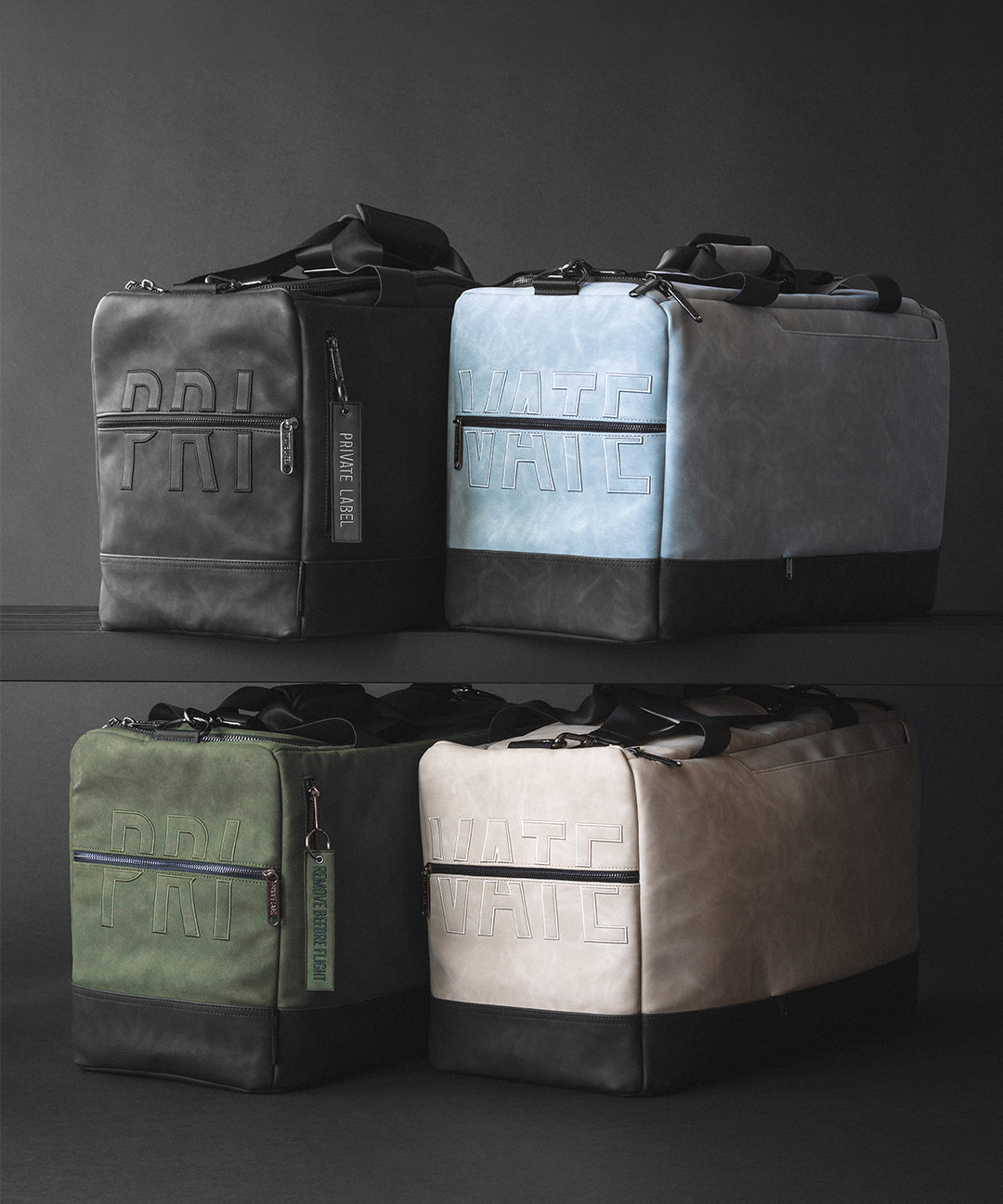 four premium vegan leather duffle bags displayed together on a dark grey background