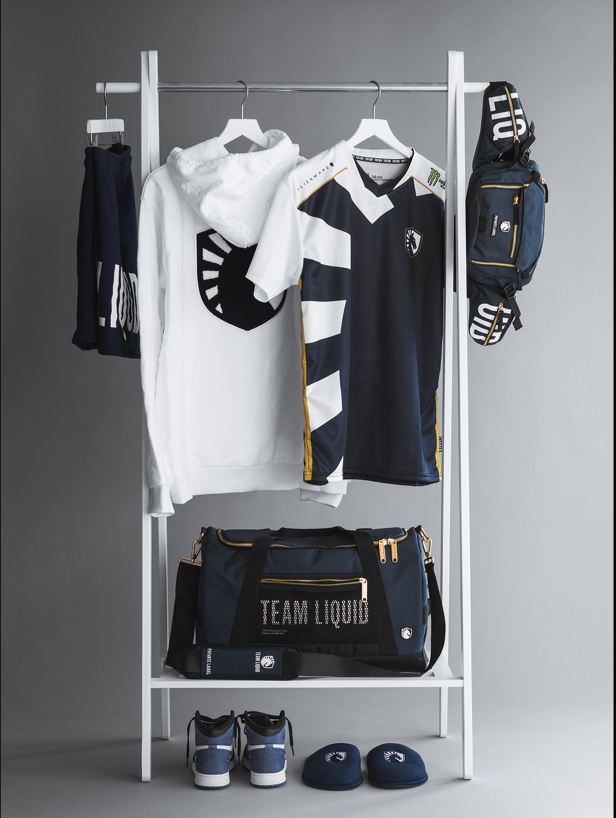 team liquid apparel and bag with shoes & slippers on a rack