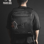 Gif of a Model wearing a reflective backpack with diamond & dollar pattern on a dark background
